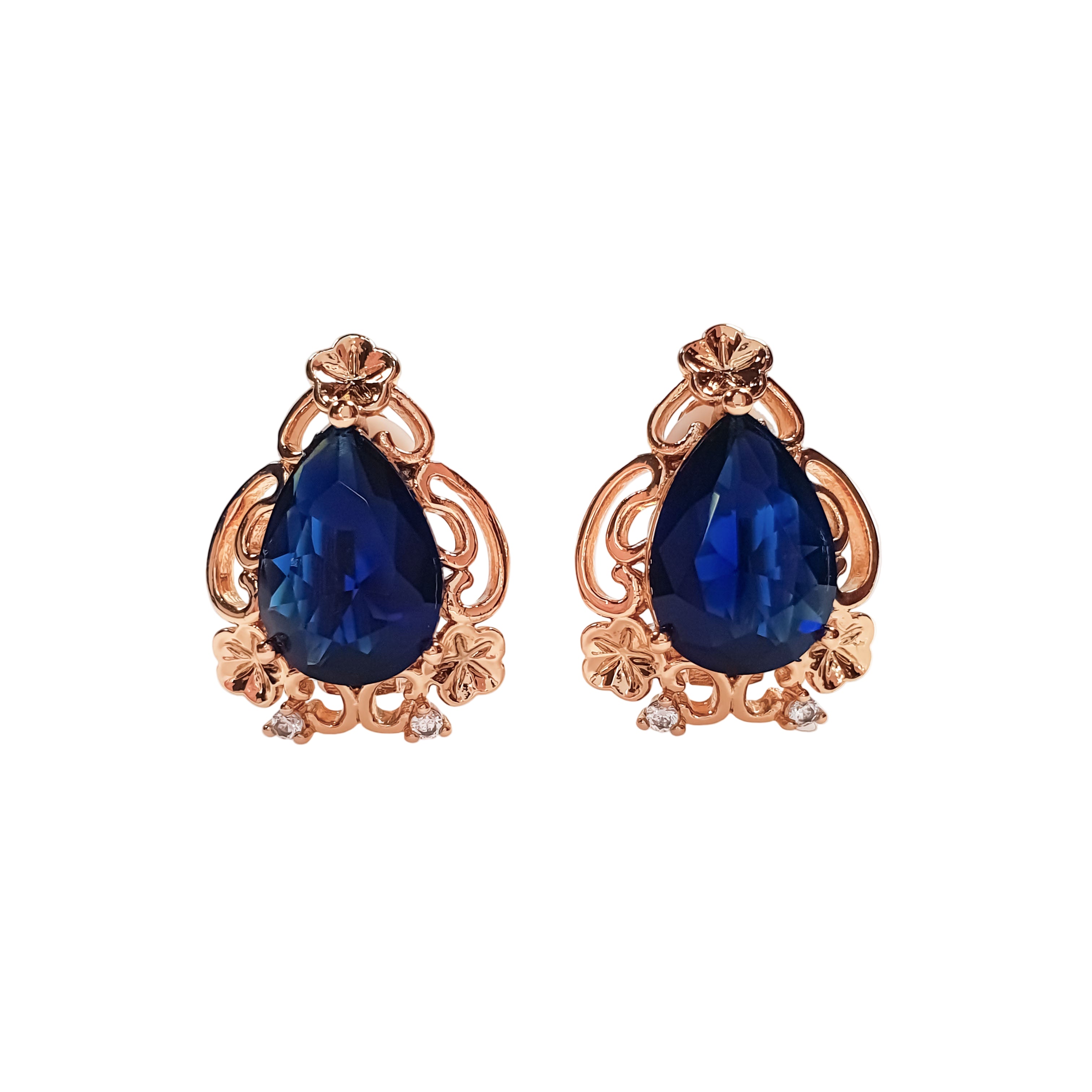 Ziedu motīva klipšu auskari ar dziļi zilu akmeni